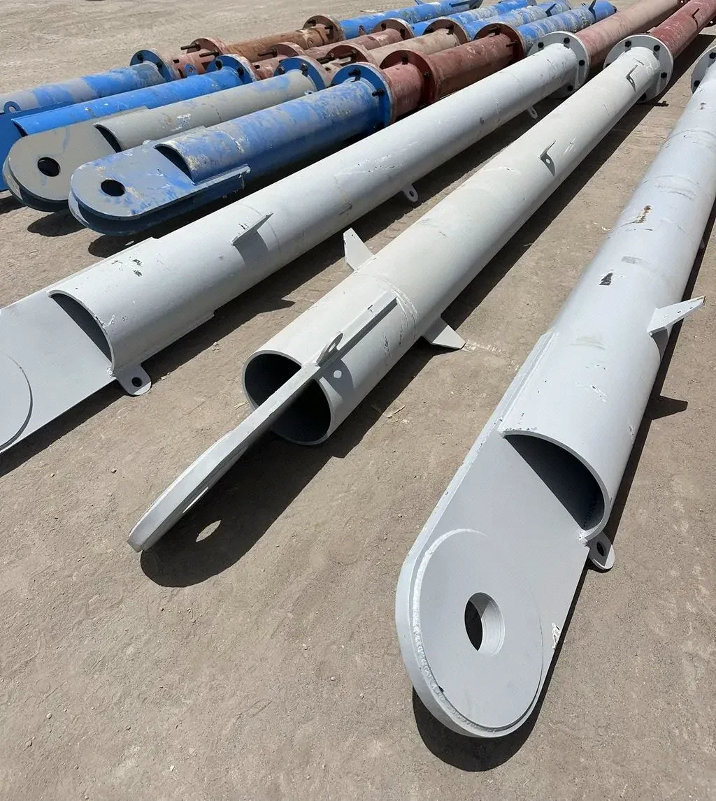 Large steel pipe sections at an offshore logistics yard